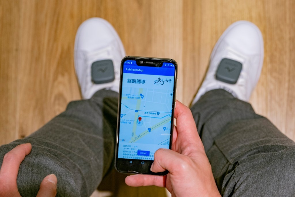 Honda Ashirase: Walking Assistance System for the Visually Impaired