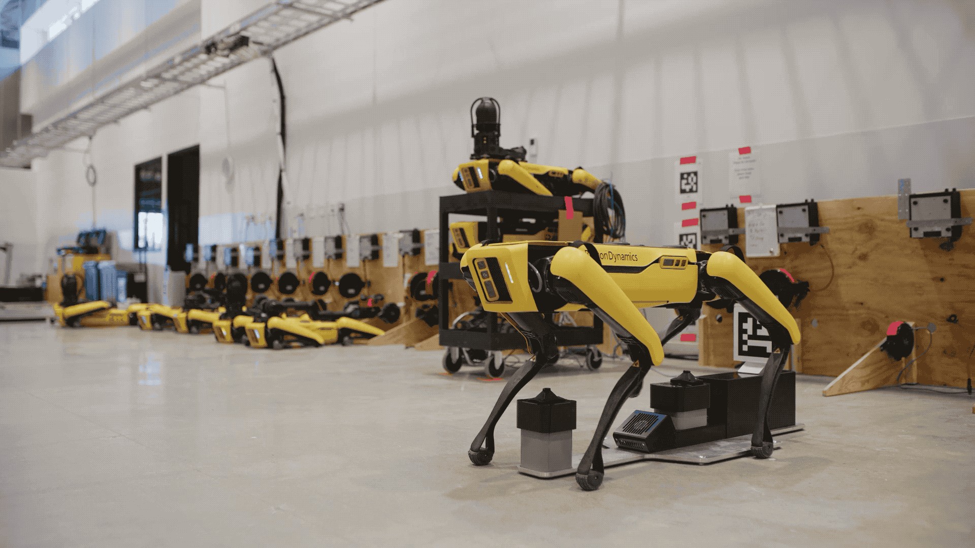boston dynamics’ spot is getting an arm and self-charging dock next year
