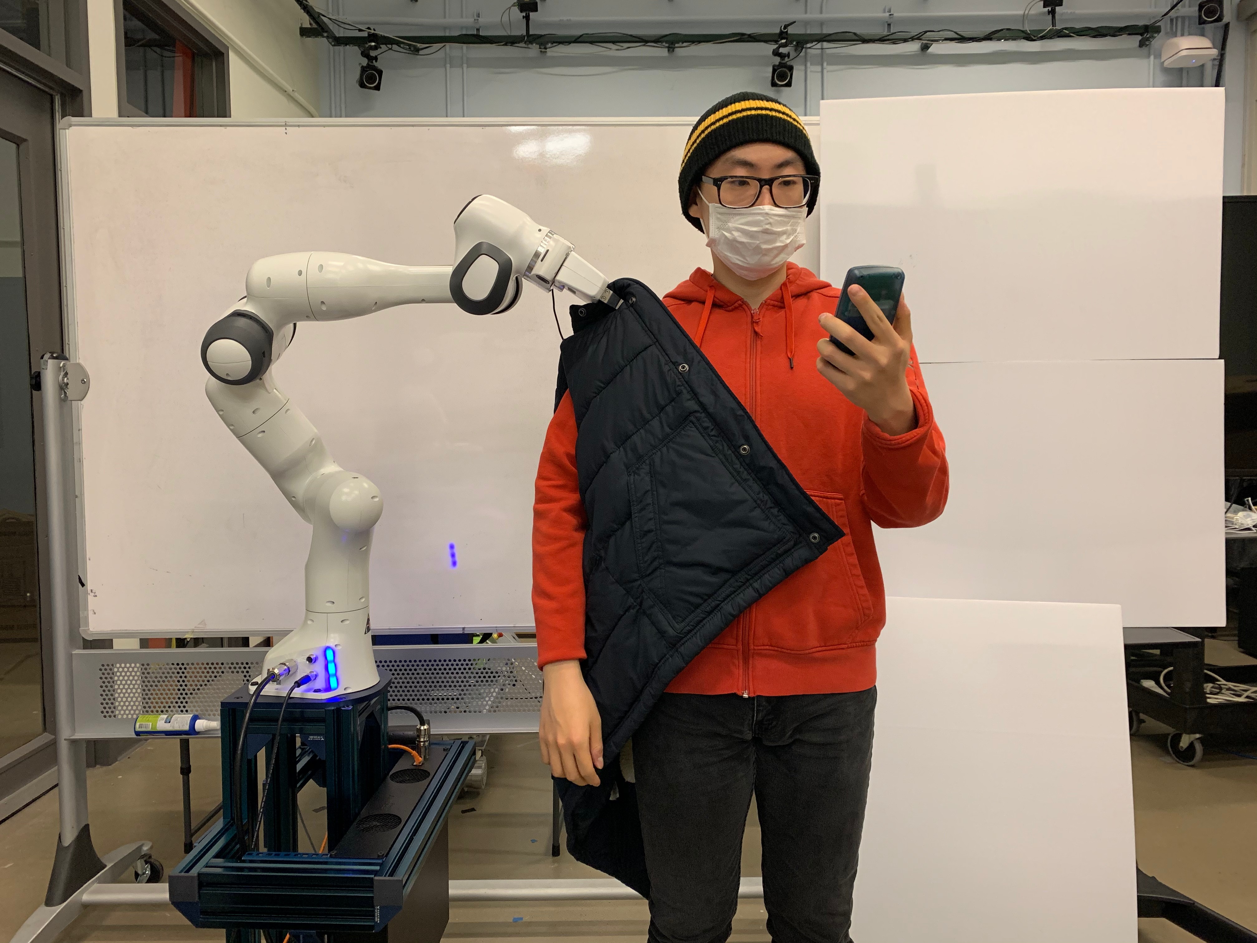 programming robots to put jackets on people is harder than it looks