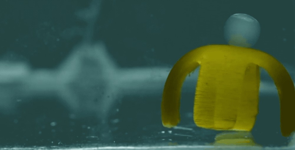 tiny water-based robot is powered by light and can walk, move cargo and even dance
